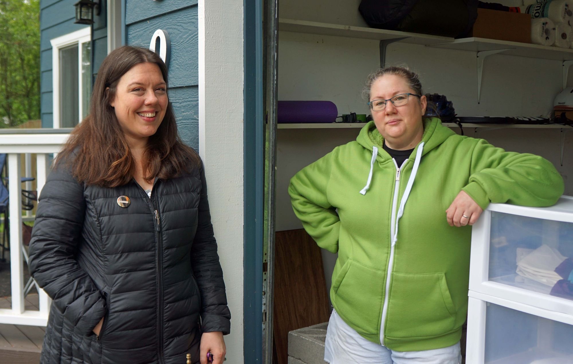   Aislinn Palmer (left) and her city council colleague Amy Howard shown at Palmer’s garage giveaway last weekend. Beacon photo by Charlie Bermant  