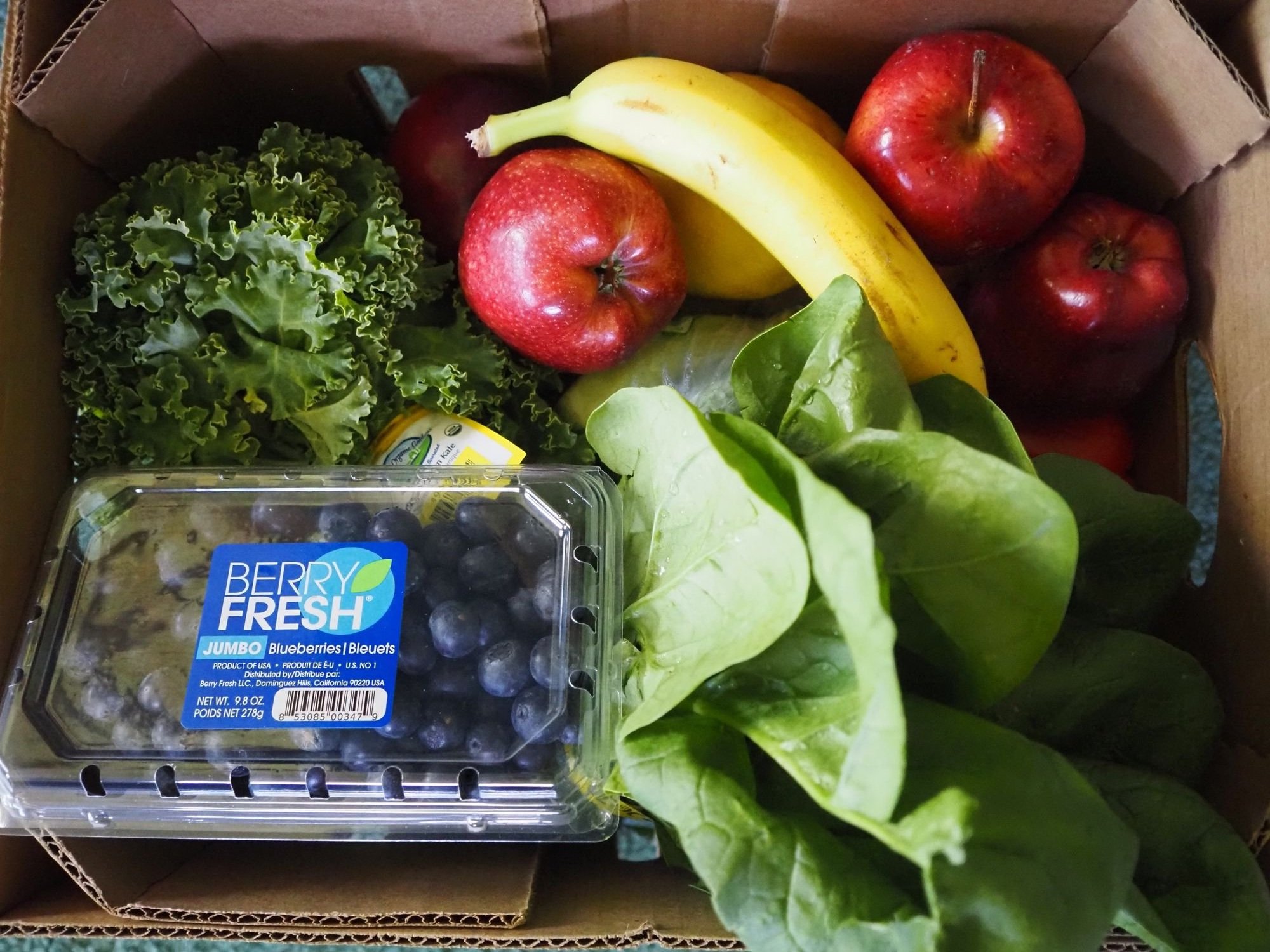   An overflowing box of fresh produce from the Tri-Area Food Bank. Beacon photo by Derek Firenze  