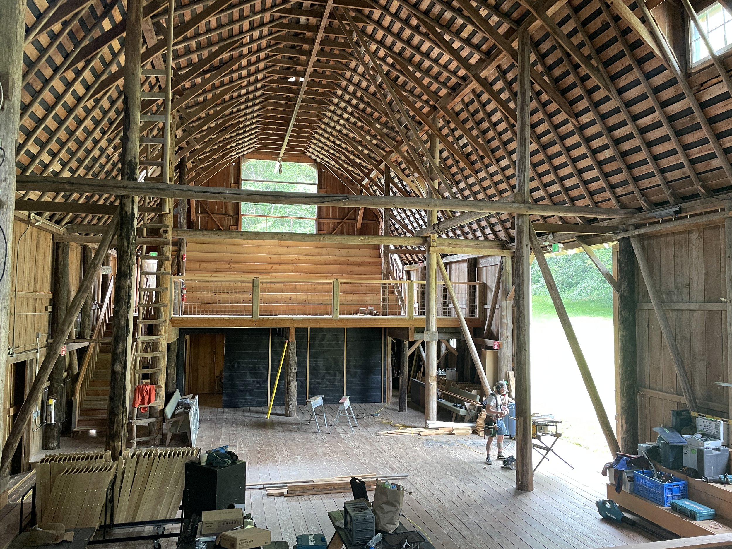   Samuel Hughes works in the barn at the Quilcene Lantern, the venue for this weekend's Tarboo music festival. Photo by Angela Downs  