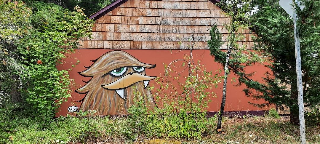  One of the One Thousand Sasquatch Heads can be found on a side street in Quilcene. Photo by Kathie Meyer  