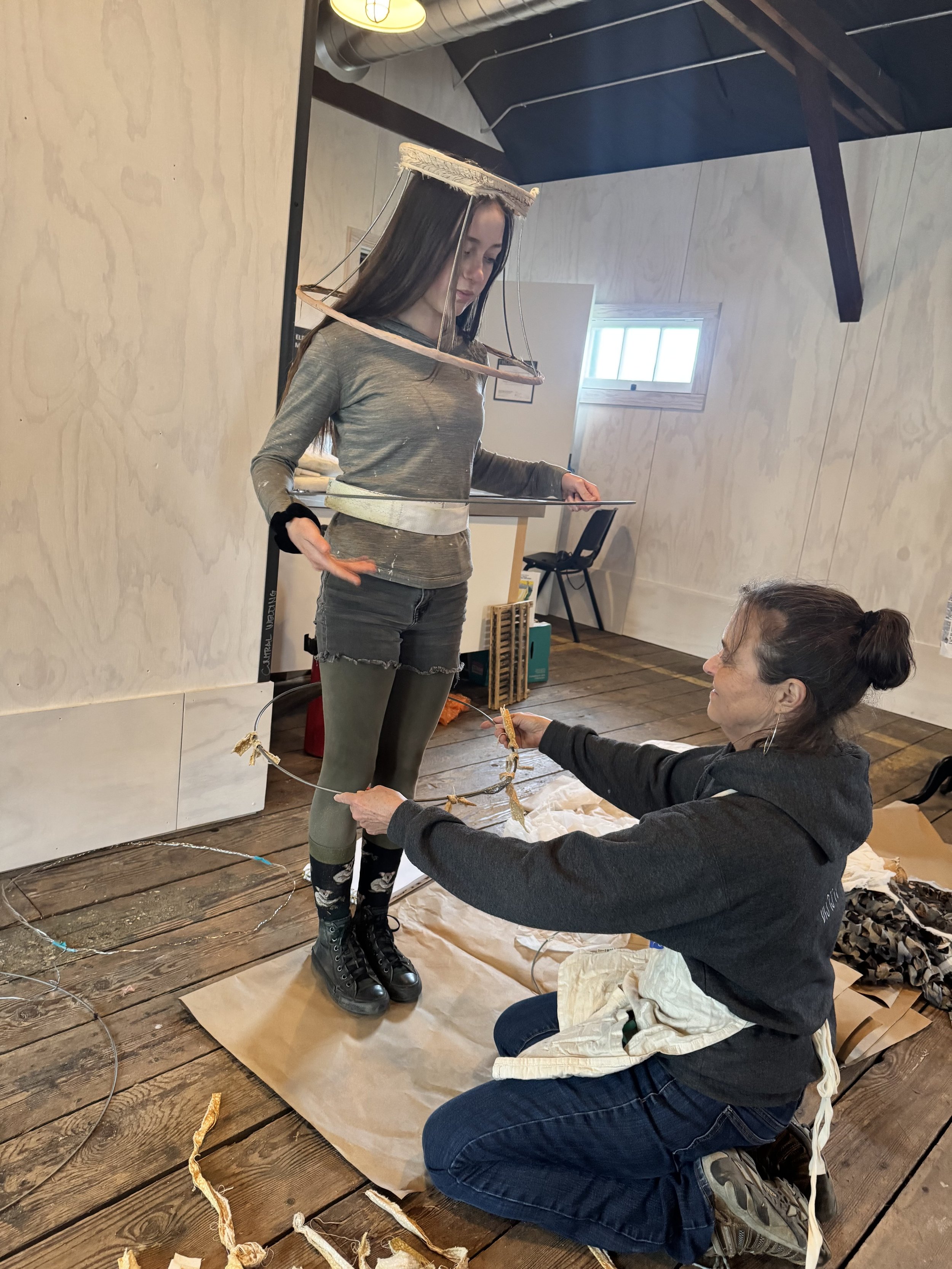   Margie McDonald (right) helps Eponine Bertucci construct her piece. Photo by Camille Hildebrandt.  