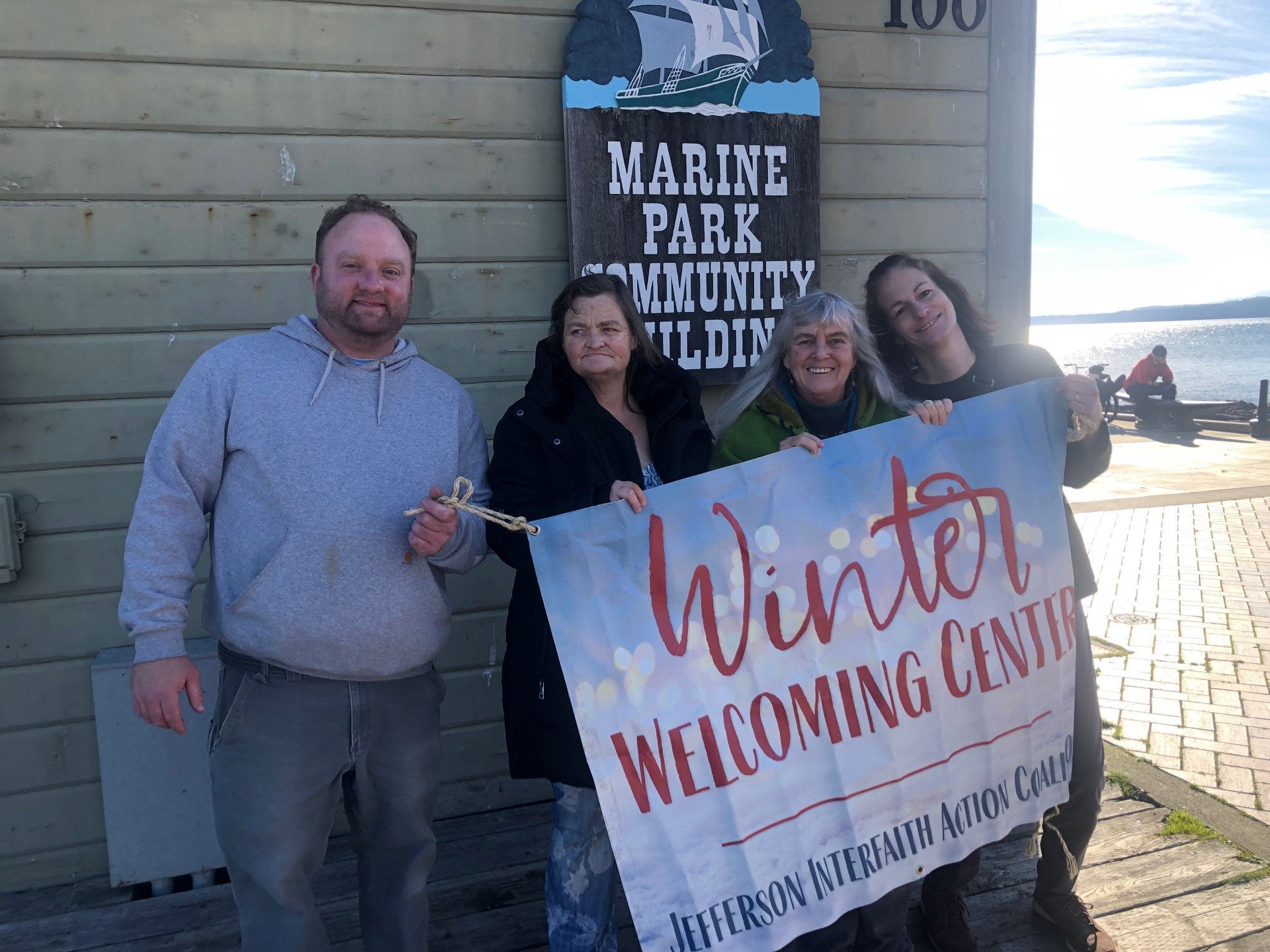   Ben Casserd, Manager; Janet Dizick, monitor; Julia, and Lisa Anderson, former Center worker, now Host at the Emergency Shelter. Photo by Paul Heins  