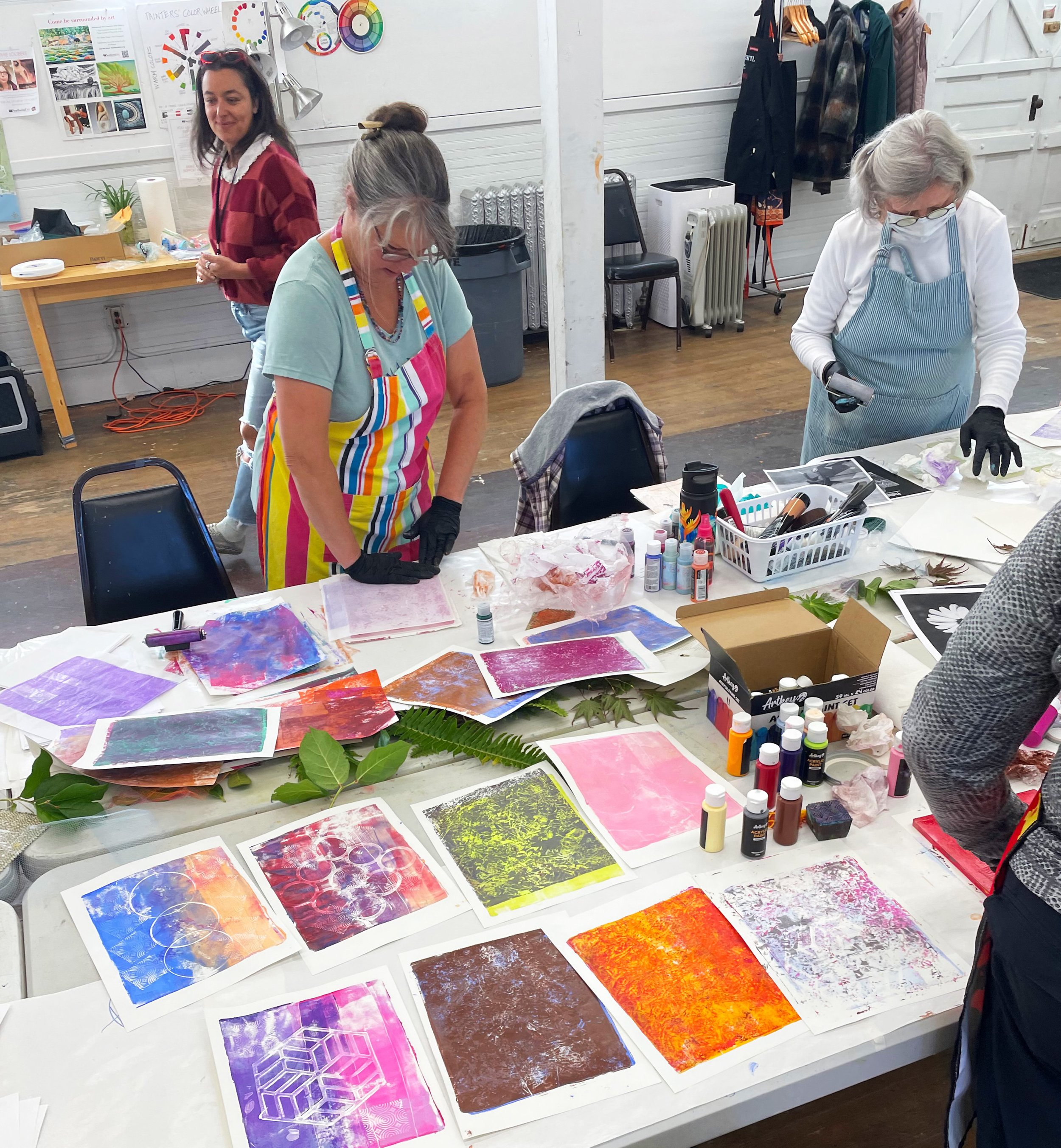   Participants in a Northwind Art School class make collage papers at Northwind's Fort Worden State Park studios. Photo by Martha Worthley   
