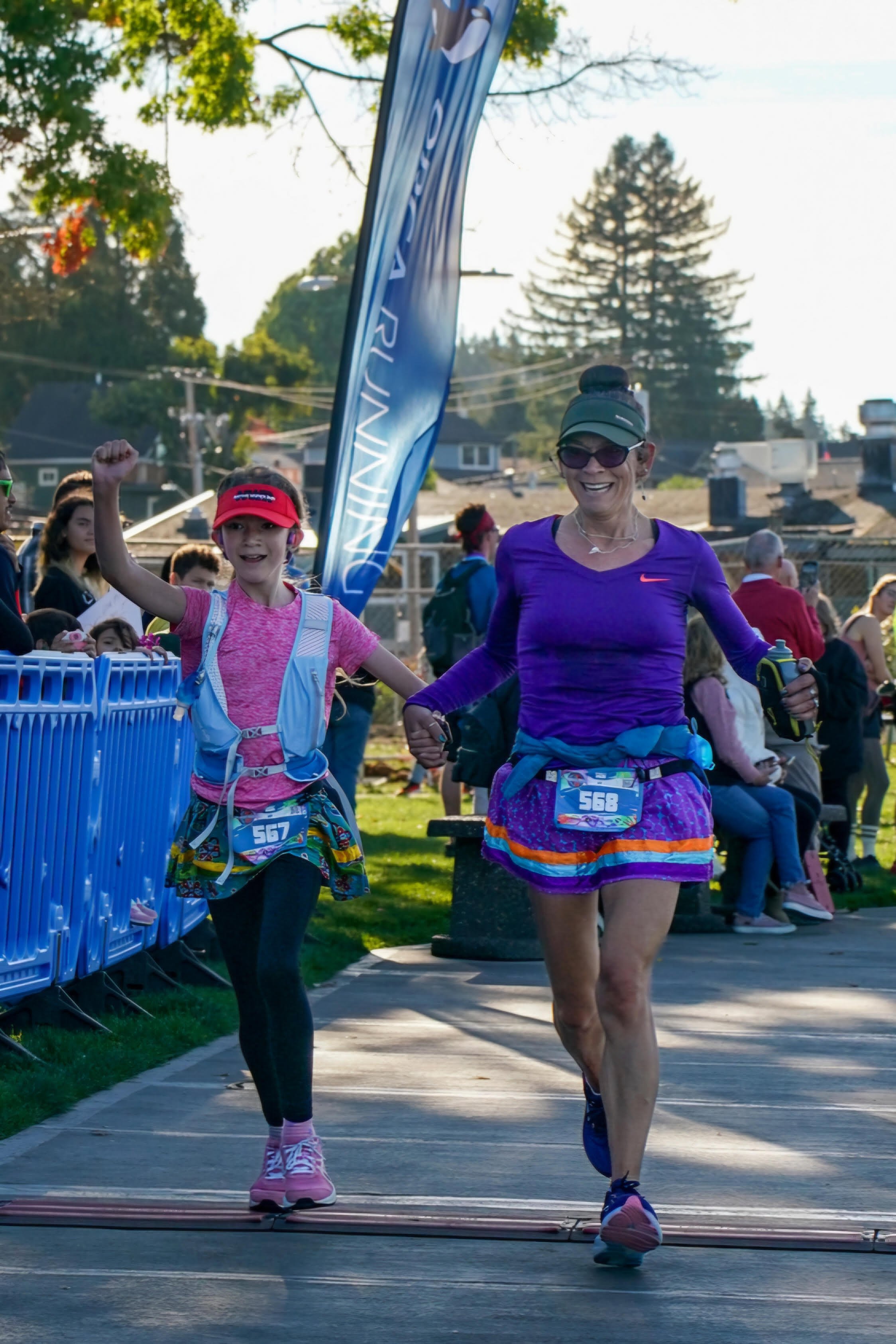   Sabrina McQuillen Hill and her daughter Mary, 12, cross the finish line of Mary’s first 10K race earlier this year in Poulsbo. Photo courtesy of Sabrina McQuillen Hill.  