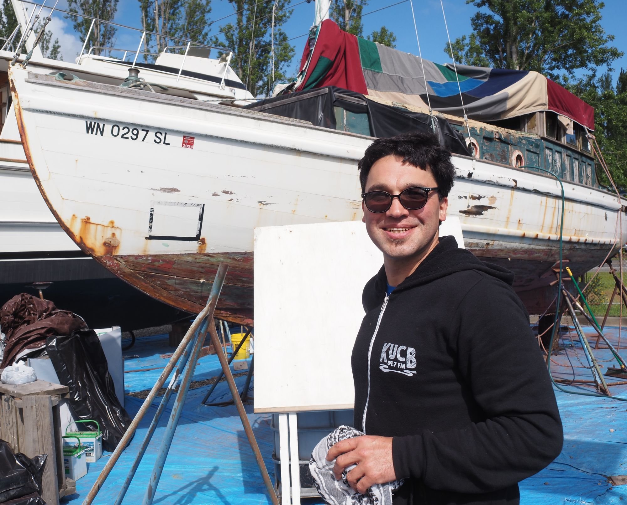   Mike Ferguson took over ownership of Seaweed on May 23, and began scraping away at her hull to get started on a restoration. Beacon photos by Derek Firenze  