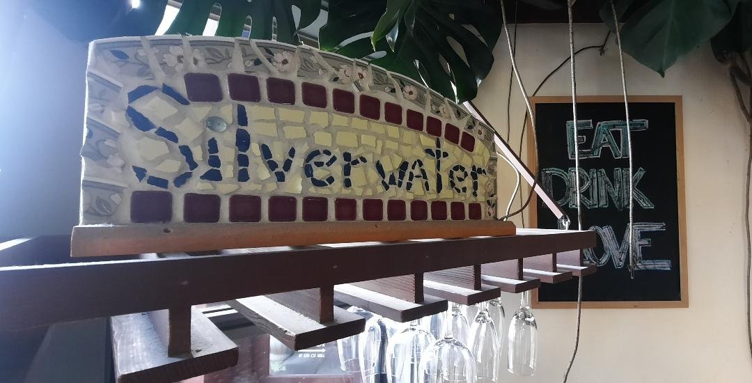   A mosaic made from pieces of the handthrown plates made by David Hero for the original Silverwater location is part of the decor. Photo by Kathie Meyer  