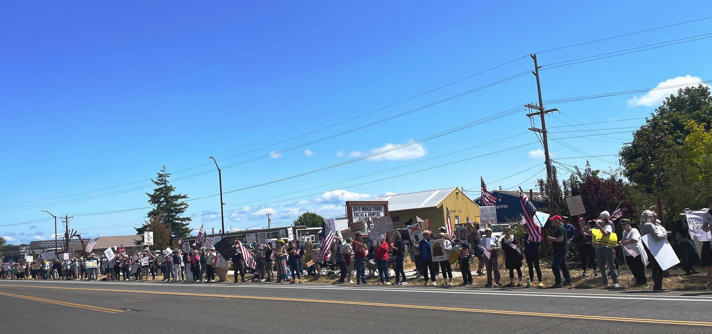   Roughly two thousand protesters lined Sims Way on Saturday for the No Kings protest. Photo Angela Downs  
