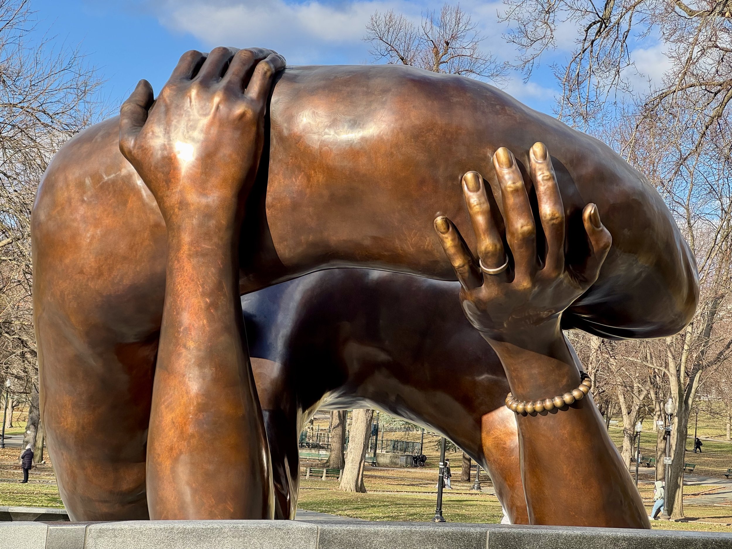  Photo:  Boston Common: Bronze sculpture ‘The Embrace’ by Hank Willis Thomas and MASS Design Group, honouring the life and legacy of Rev. Dr. Martin Luther King, Jr. and Coretta Scott King, based on a photo after Dr King was awarded the Nobel Peace Prize in 1964. Photo by Beena Sarwar.&nbsp;  