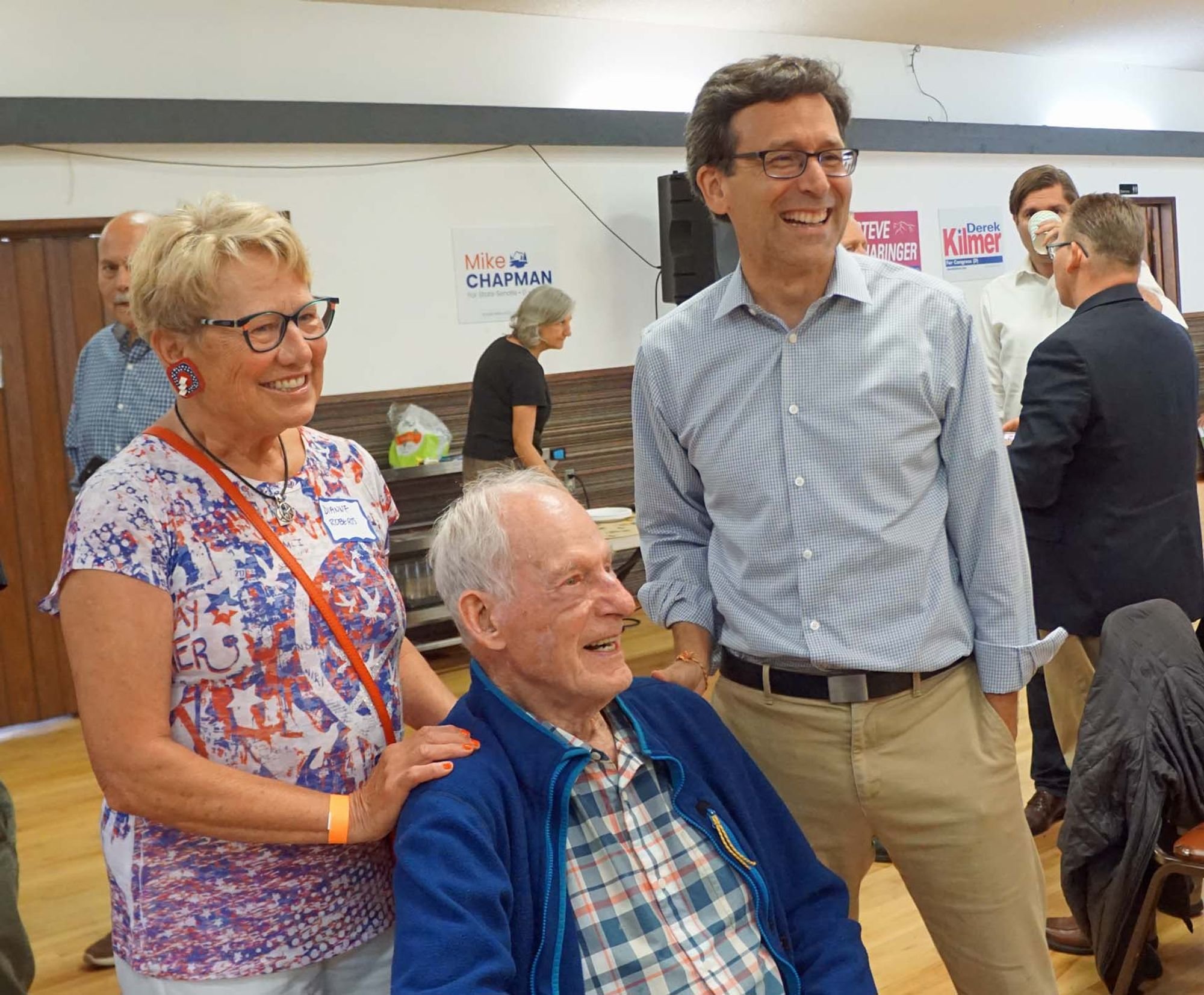   Jim Whittaker (seated) and his wife Dianne Roberts chat with gubernatorial candidate Bob Ferguson.  