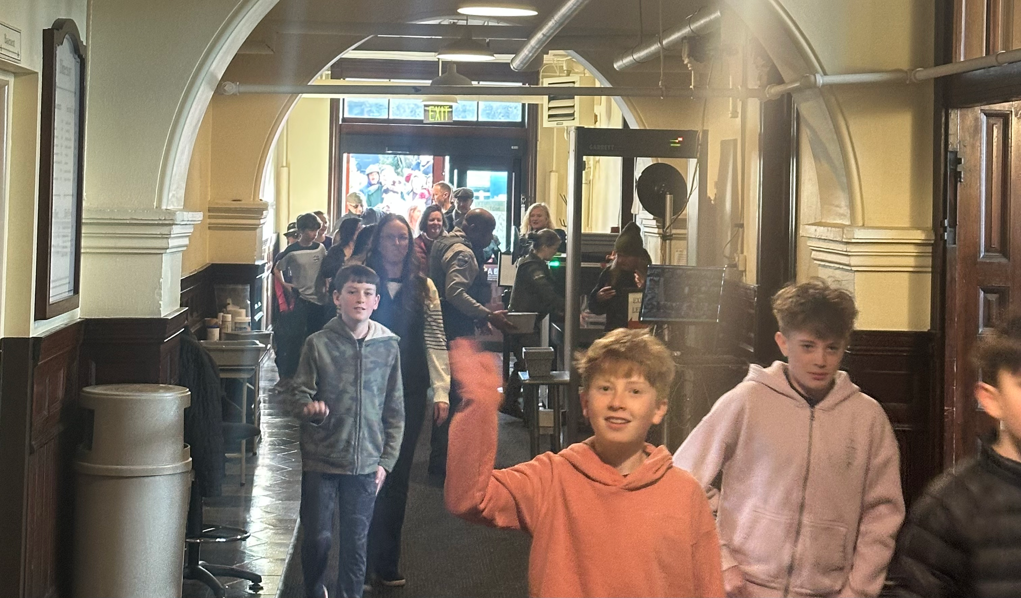 Parents and kids file through the security entrance of the Jefferson County Courthouse
