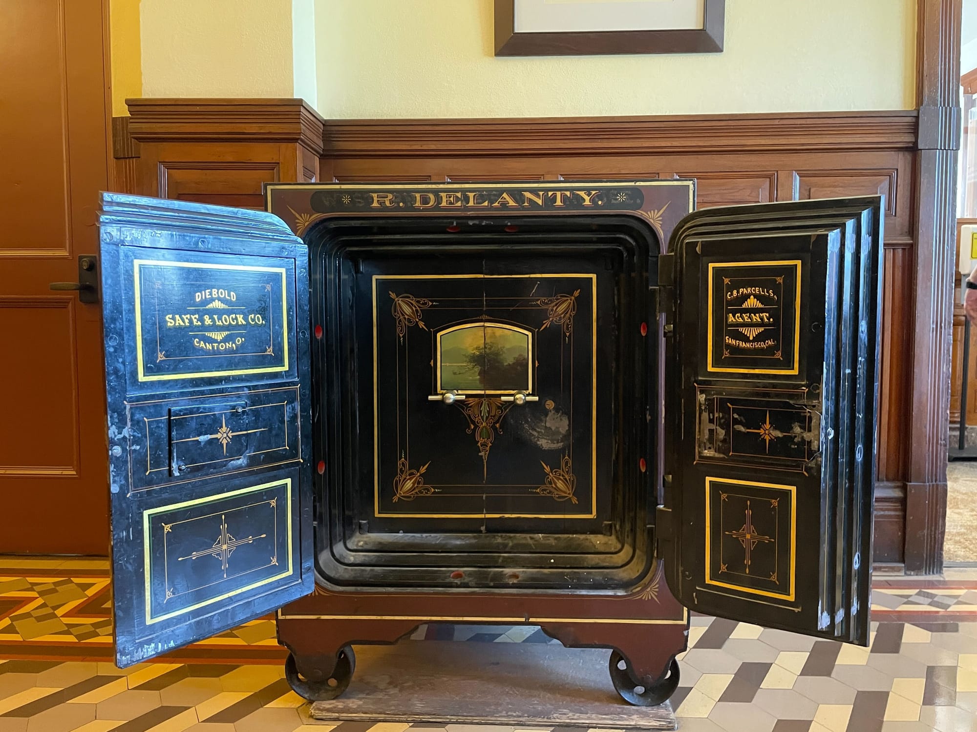 An antique safe from Diebold Safe & Lock Co. Canton, O. Safe says R. Delanty. across the top. 