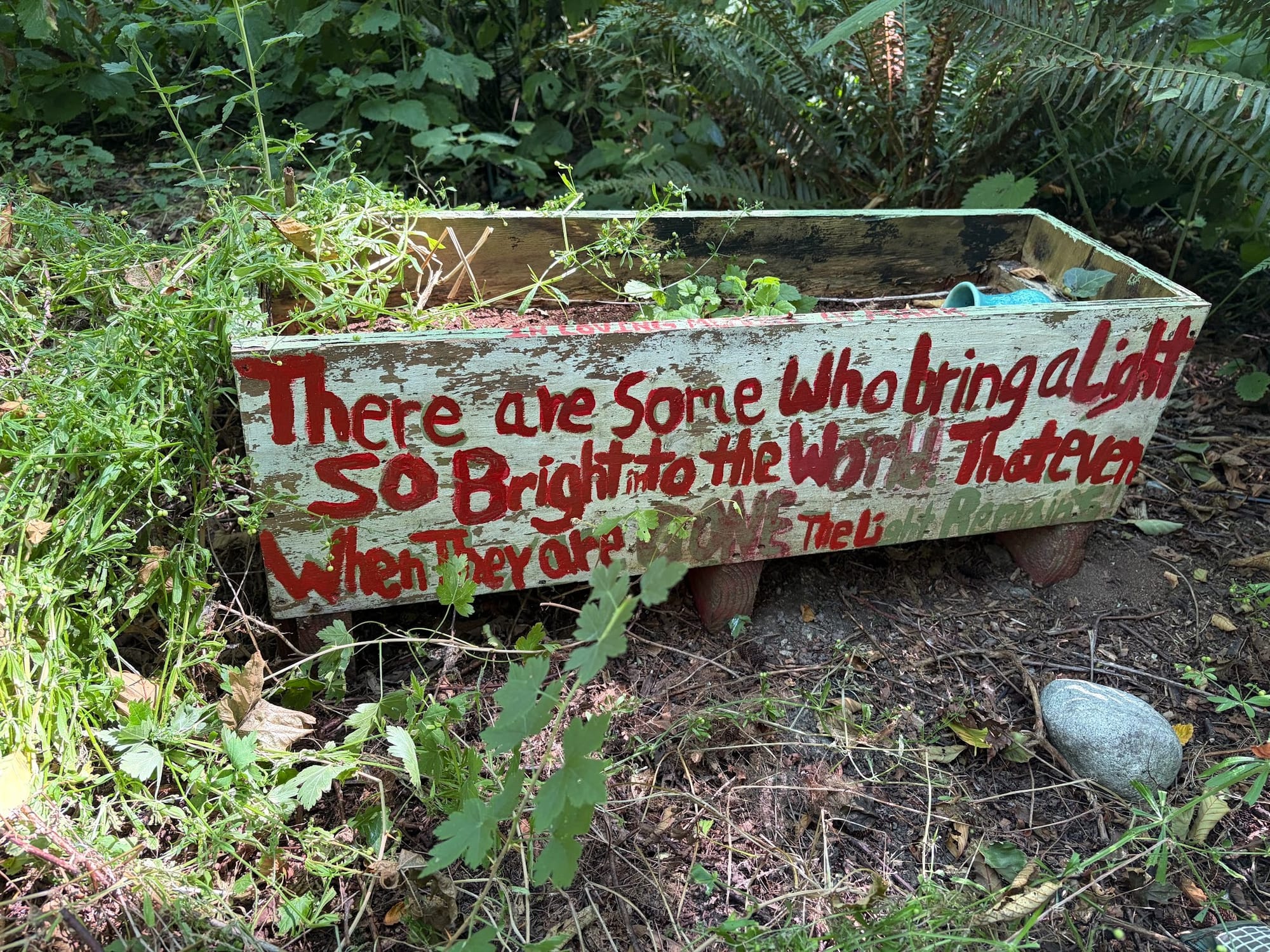 Flower box message: "There are some who bring a light so bright to the world that even when they are gone the light remains".