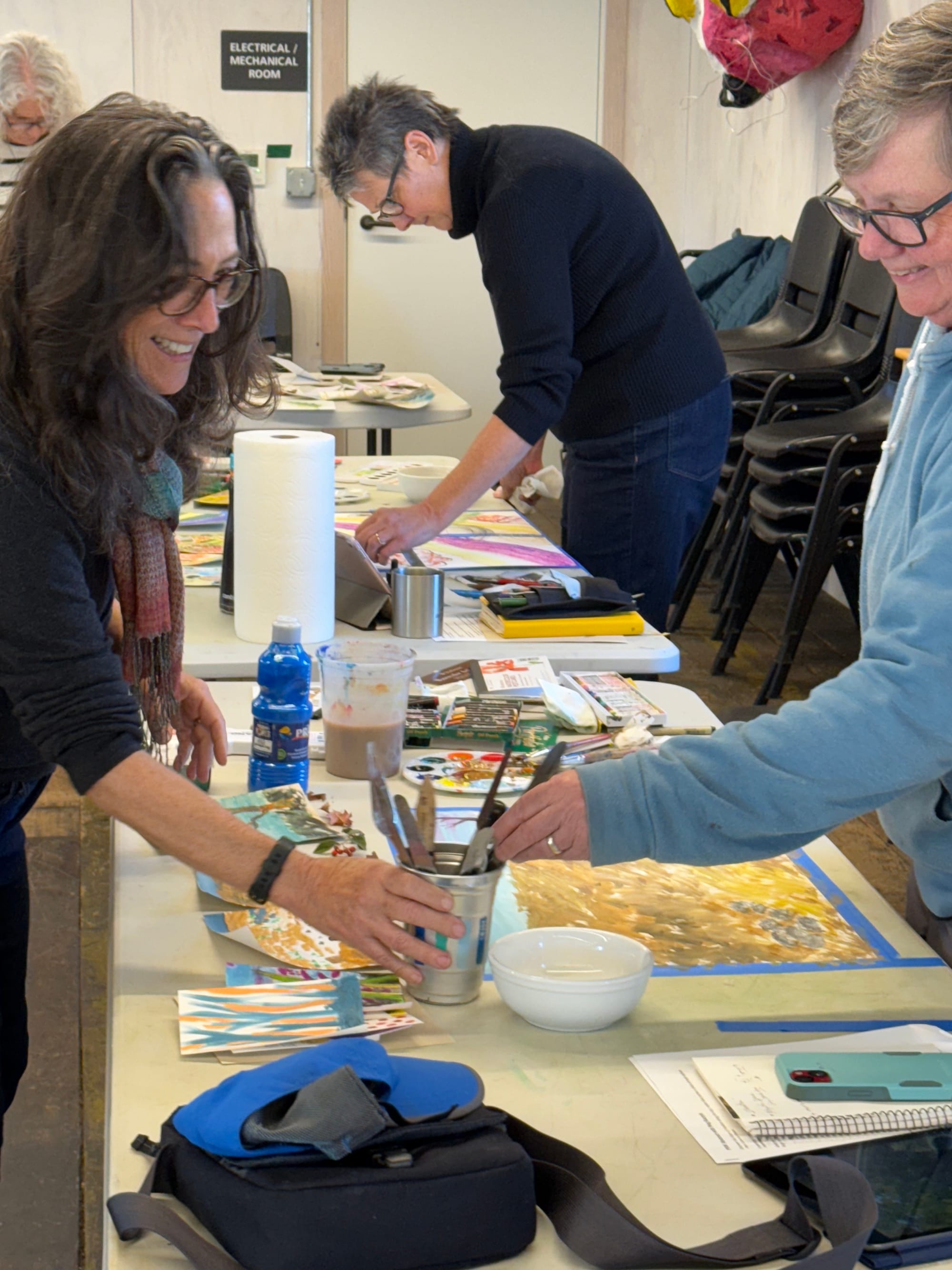 Artist Meg Kaczyk, left, is shown teaching her Pacific Northwest Abstract class at Northwind Art.