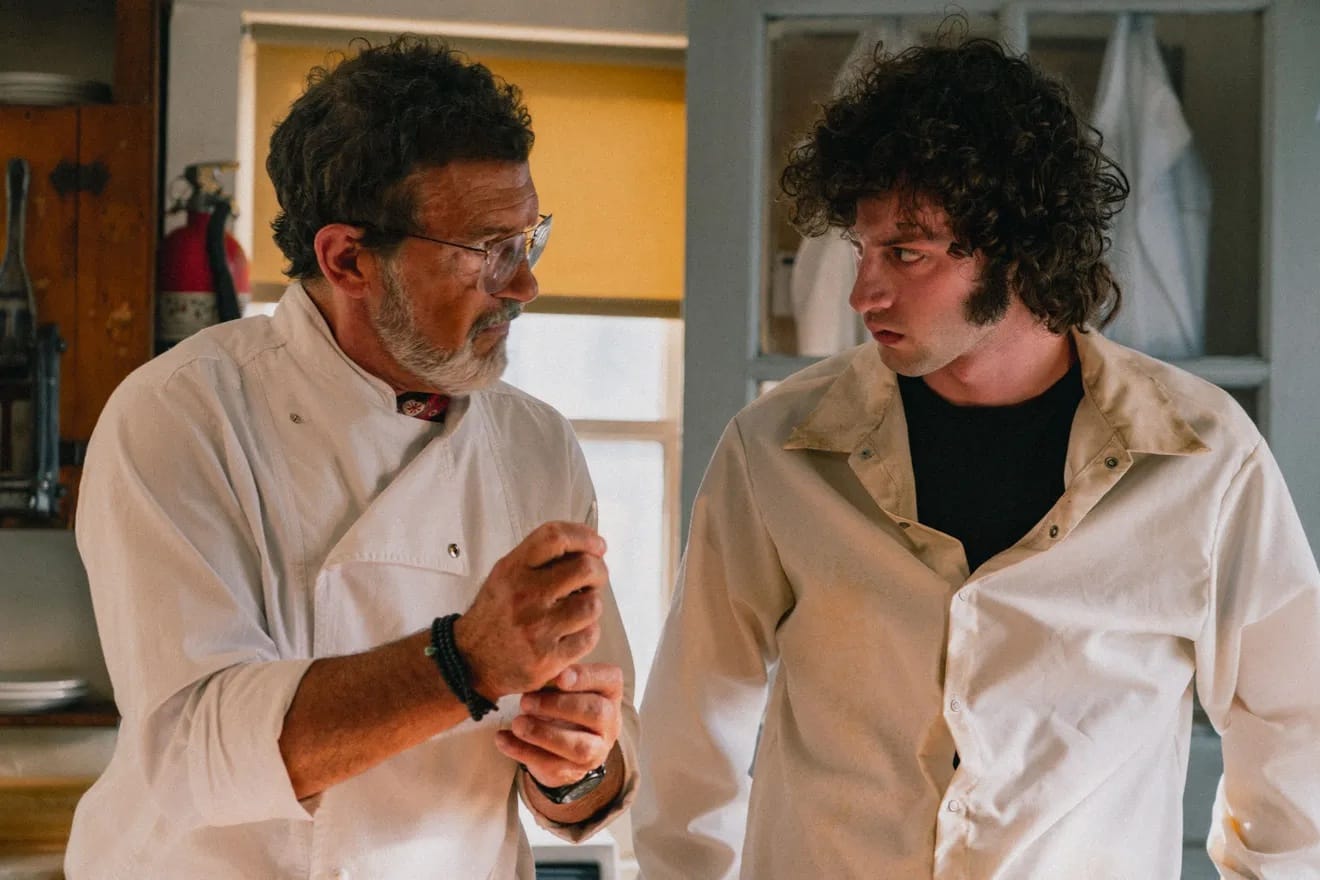 Antonio Banderas, left, schools his protege, played by Dominic Sessa, in chef coats.