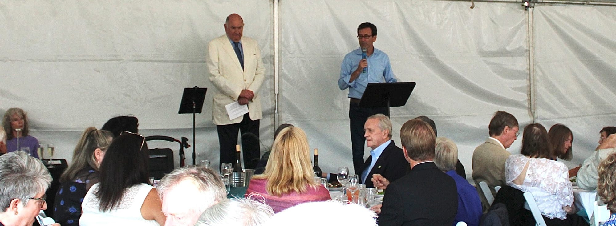 BHS Executive Director Gary Keister, left, and Governor Bob Ferguson speaking to the crowd.