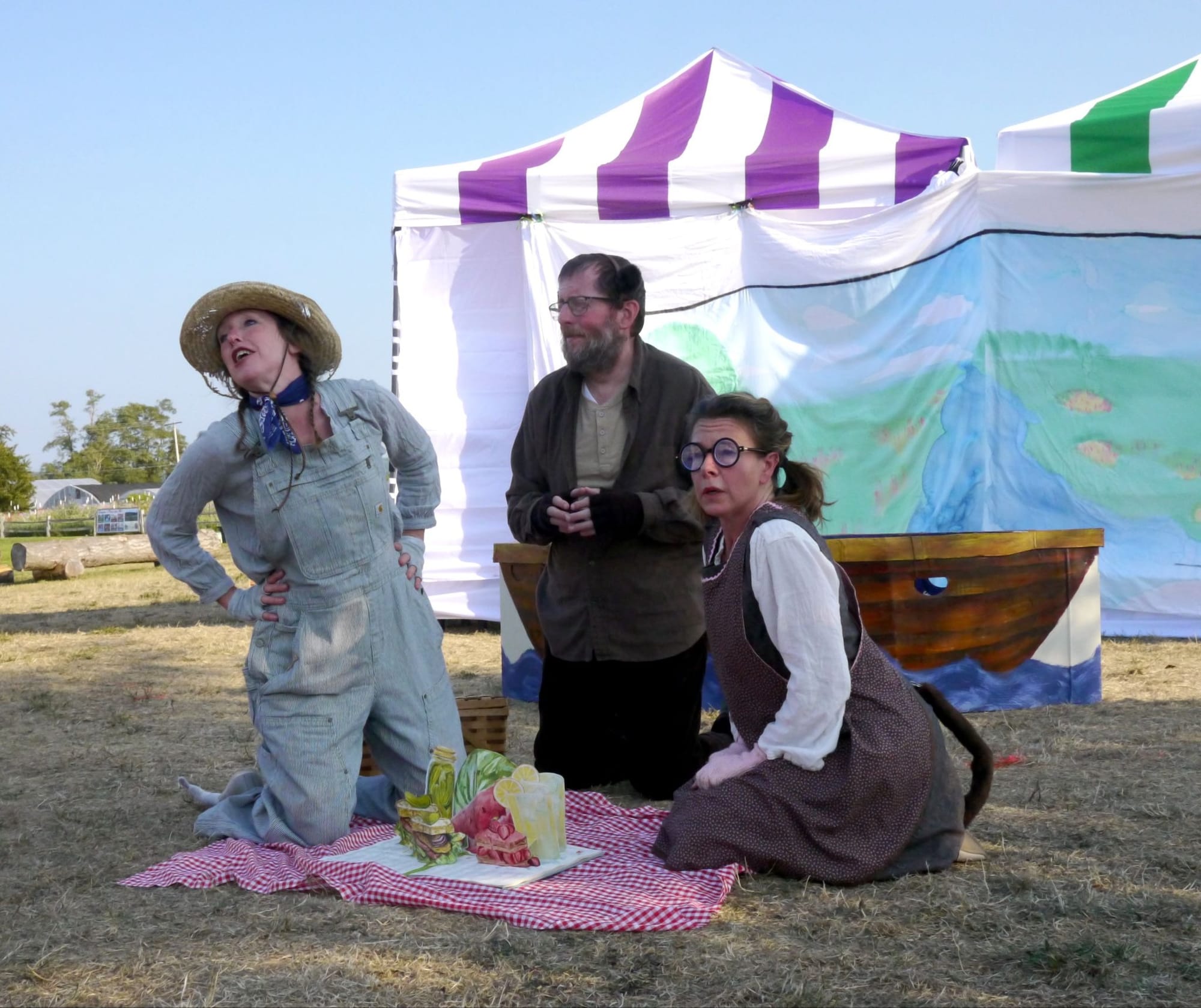 Rat, Otter and Mole on a picnic blanket with their delightful picnic food props made out of paper pop-ups.