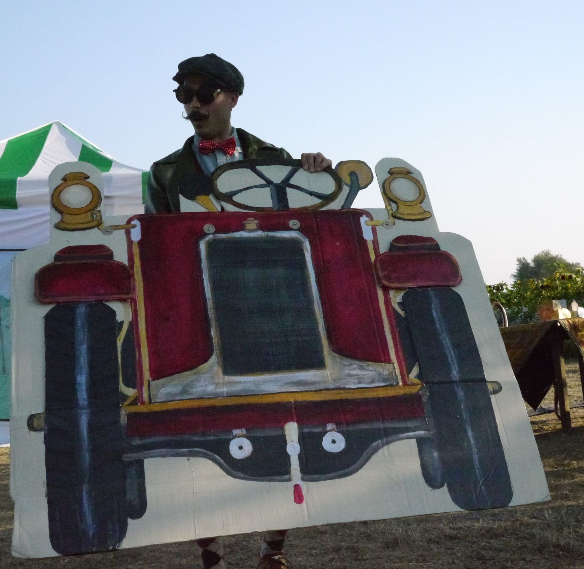 Mr Toad and his motor car. Actor Jason Noltemeier behind a cardboard cut-out car.
