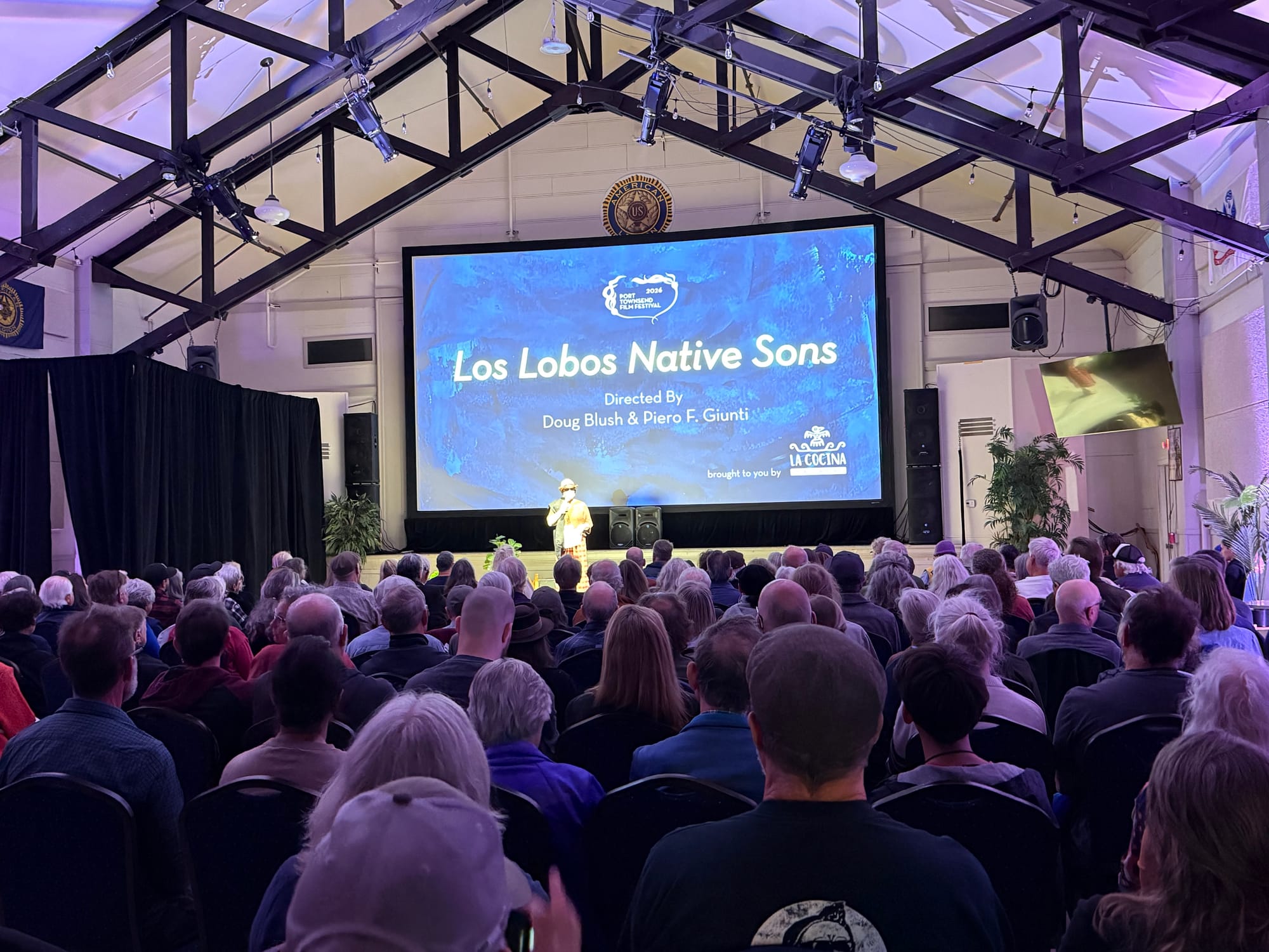 Festival program director Christy Spencer welcomes the sold-out crowd to Sunday’s screening of “Los Lobos: Native Sons” at the American Legion.