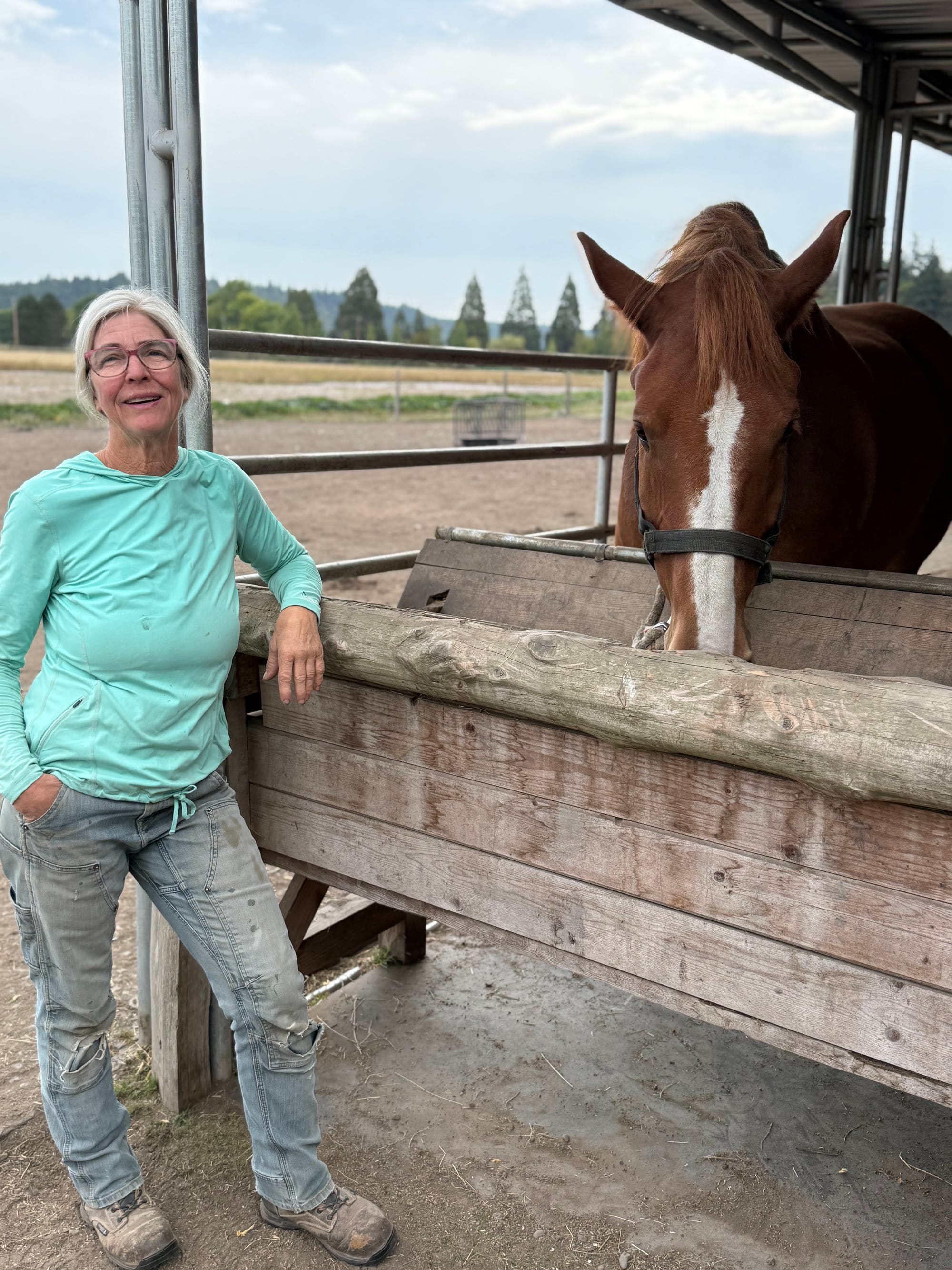 Karen Seabrook, left, pauses with John the workhorse.