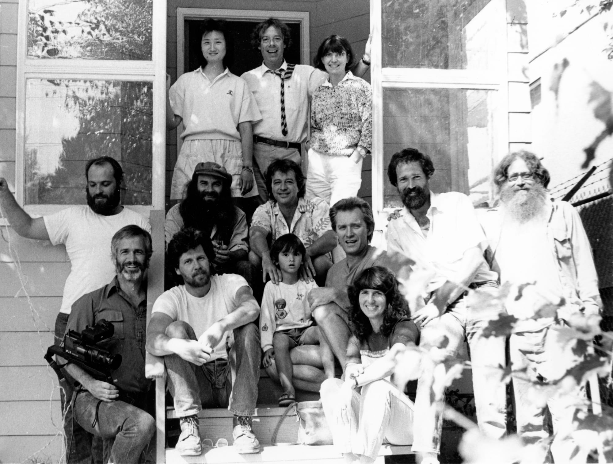 Empty Bowl poets and friends gathered for a photo at founding editor Michael Daley’s Seattle home in 1986, pictured on porch stairs.