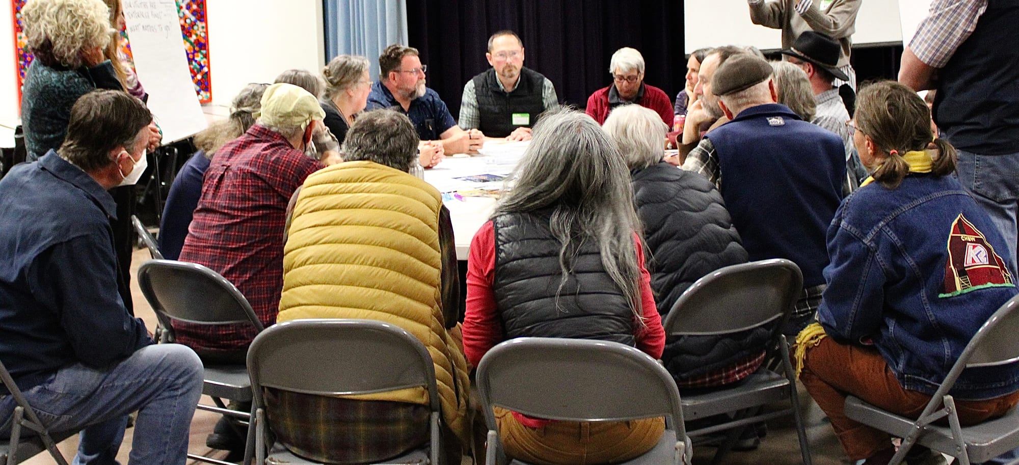 The water and sewer enterprise table with a large crowd surrounding it. 