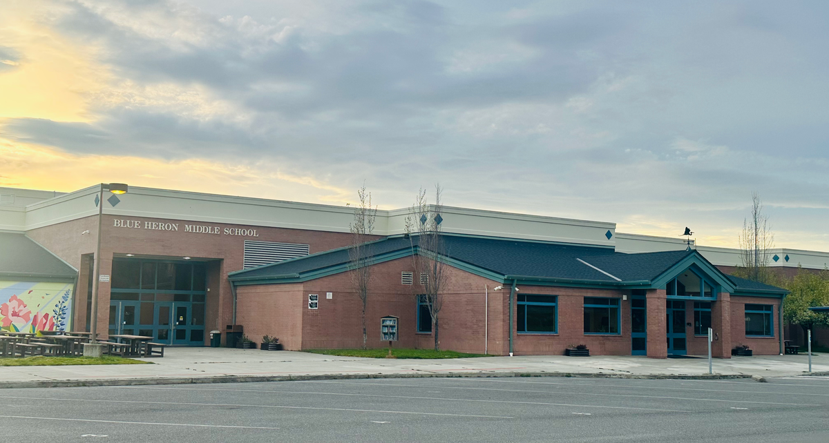 Blue Heron Middle School entrance. A red brick building with a blue roof.
