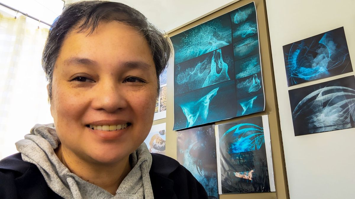 Lucia Enriquez in front of her digital artwork. 