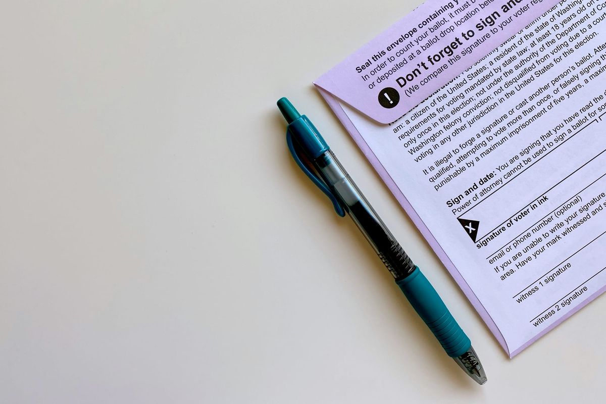A picture of a ballot and a pen. 
