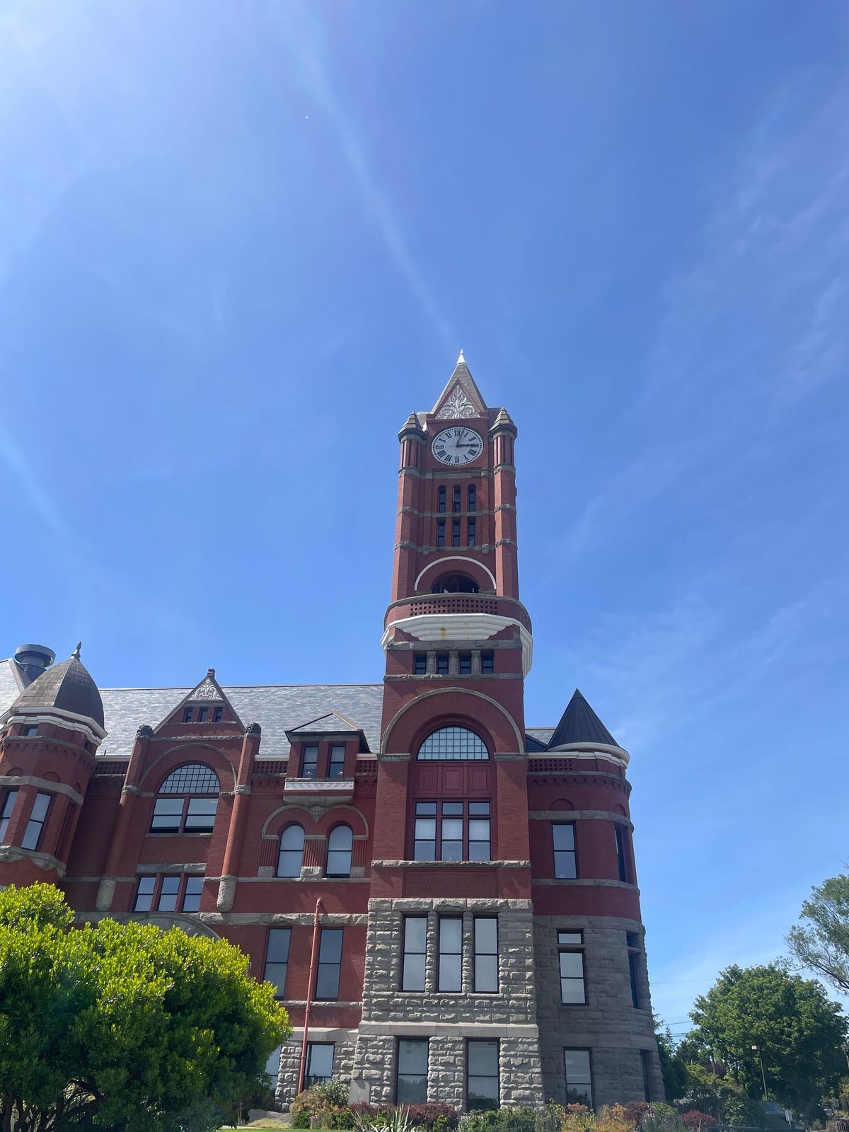 Jefferson County Courthouse, a red brick building with a clock tower on the right side. 