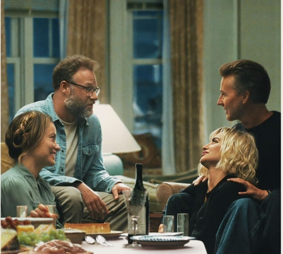 From left, Olivia Wilde, Seth Rogen, Penélope Cruz and Edward Norton, with a table of wine and food in the foreground.