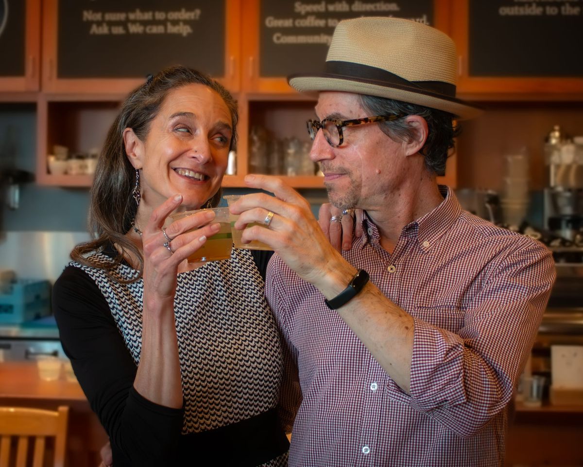 Mary Purdy, left, and Keith Hitchcock toast beverages.