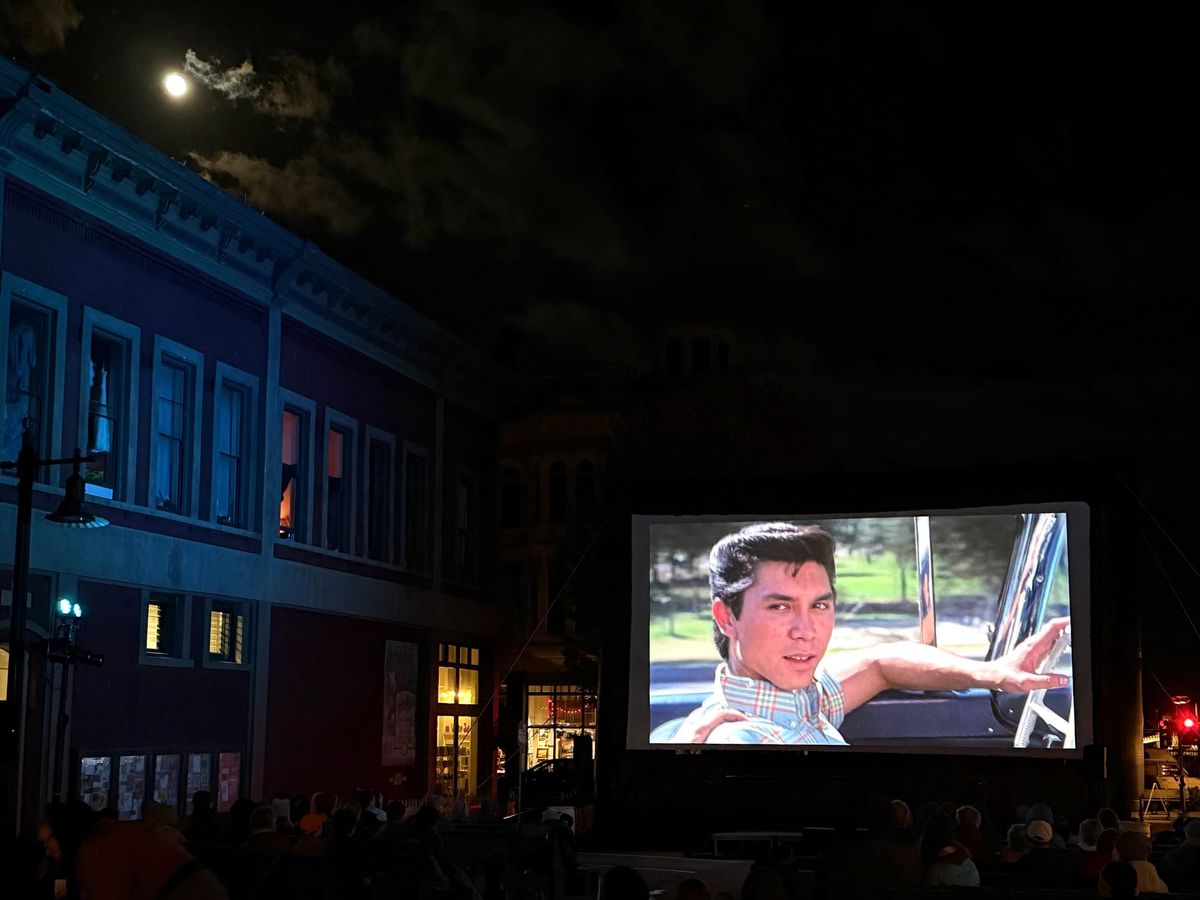 The film “La Bamba” fills the outdoor screen on Taylor Street next to the Rose. 