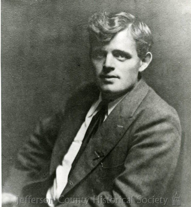 A portrait of Jack London in a jacket and tie. 