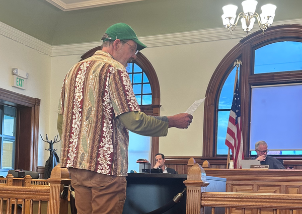 Bly Windstorm testifying in front of the city council bench. 