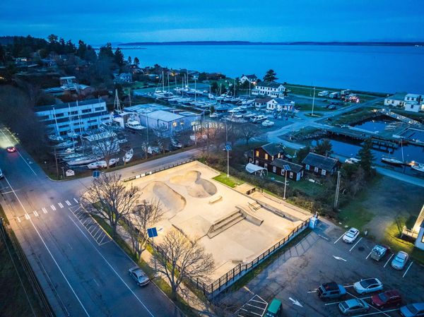An overhead photo of The Seamus Sims Skate Park in Port Townsend, lit with solar-powered lighting.Point Hudson boat yard in the background.