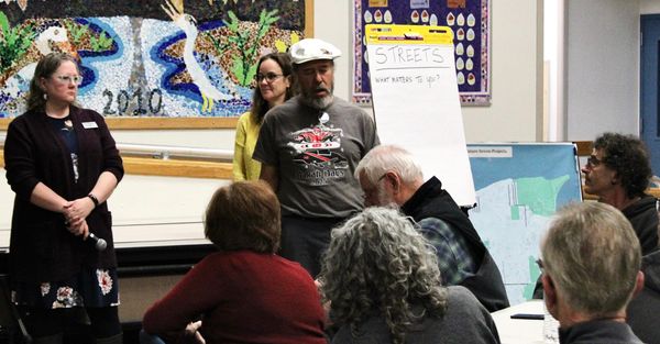 Hereditary Makah Chief Walter McQuillen with Mayor Amy Howard and Director of Finance Jodi Adams in the background.