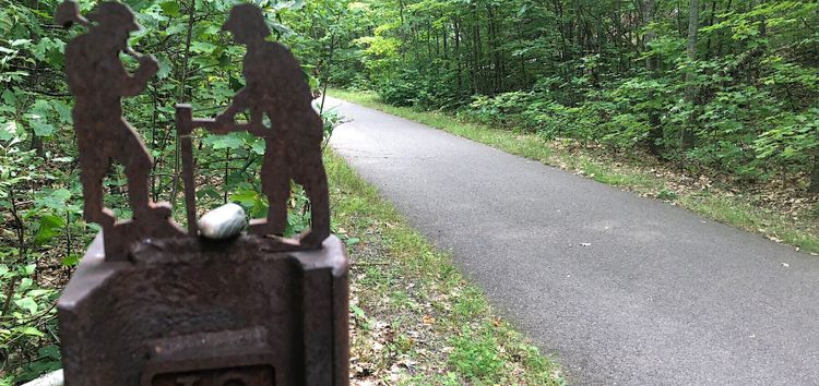 Bike path with artistic trail marker