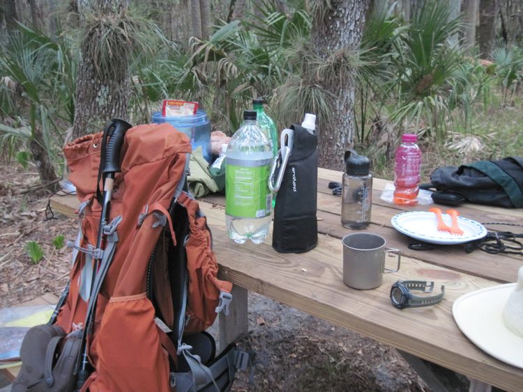 Hiking gear at a picnic table
