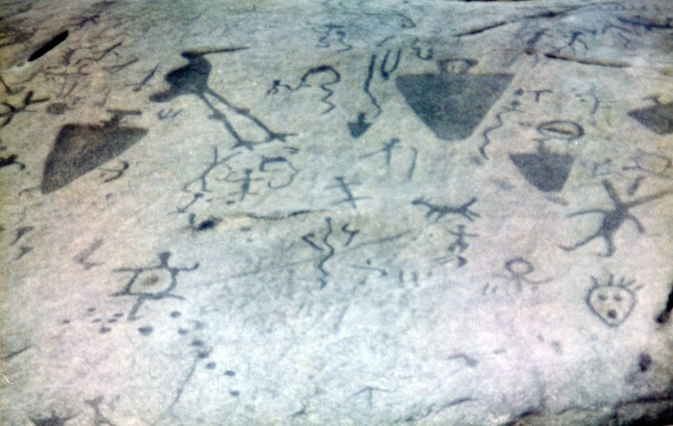 Petroglyphs carved in stone face