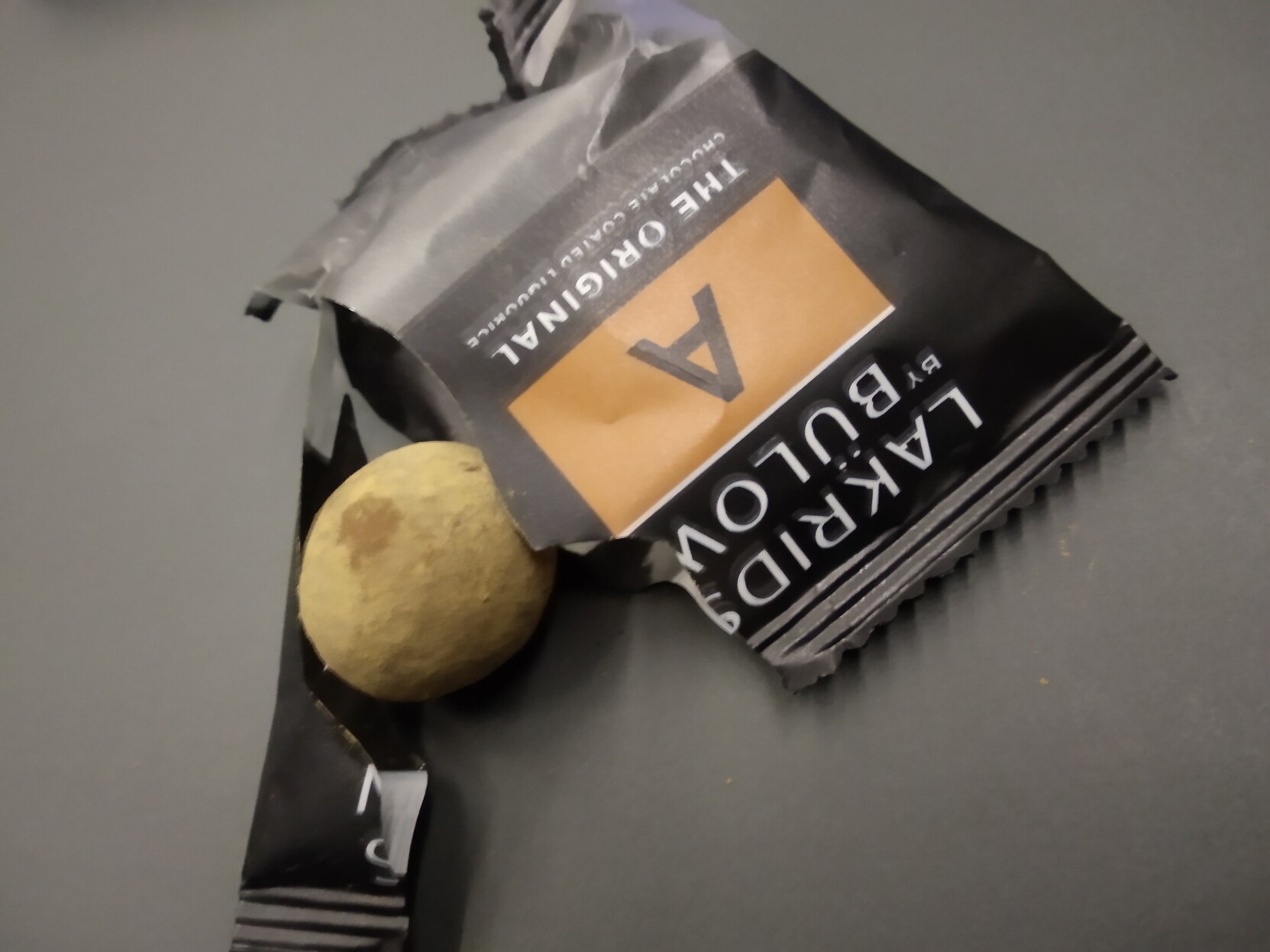 A liquorice ball of horror and its packaging.