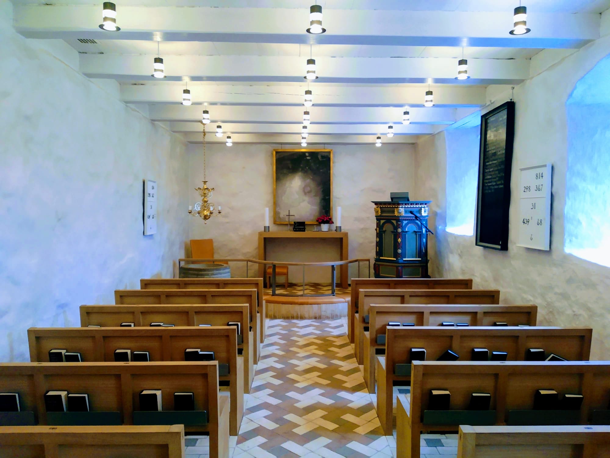 White interior of the smallest church in Denmark.