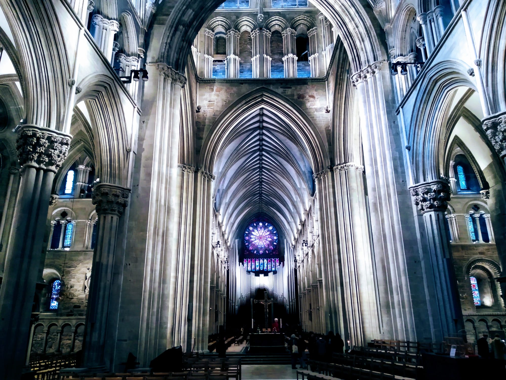 The rose window and organ dominate the west end of Nidaros Cathedral.