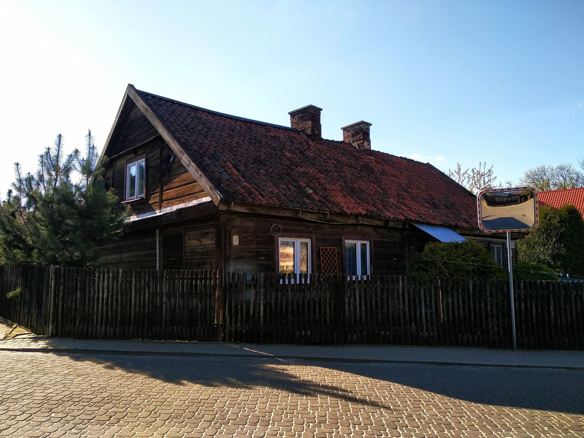 A two-storey wooden house in a quiet residential area.