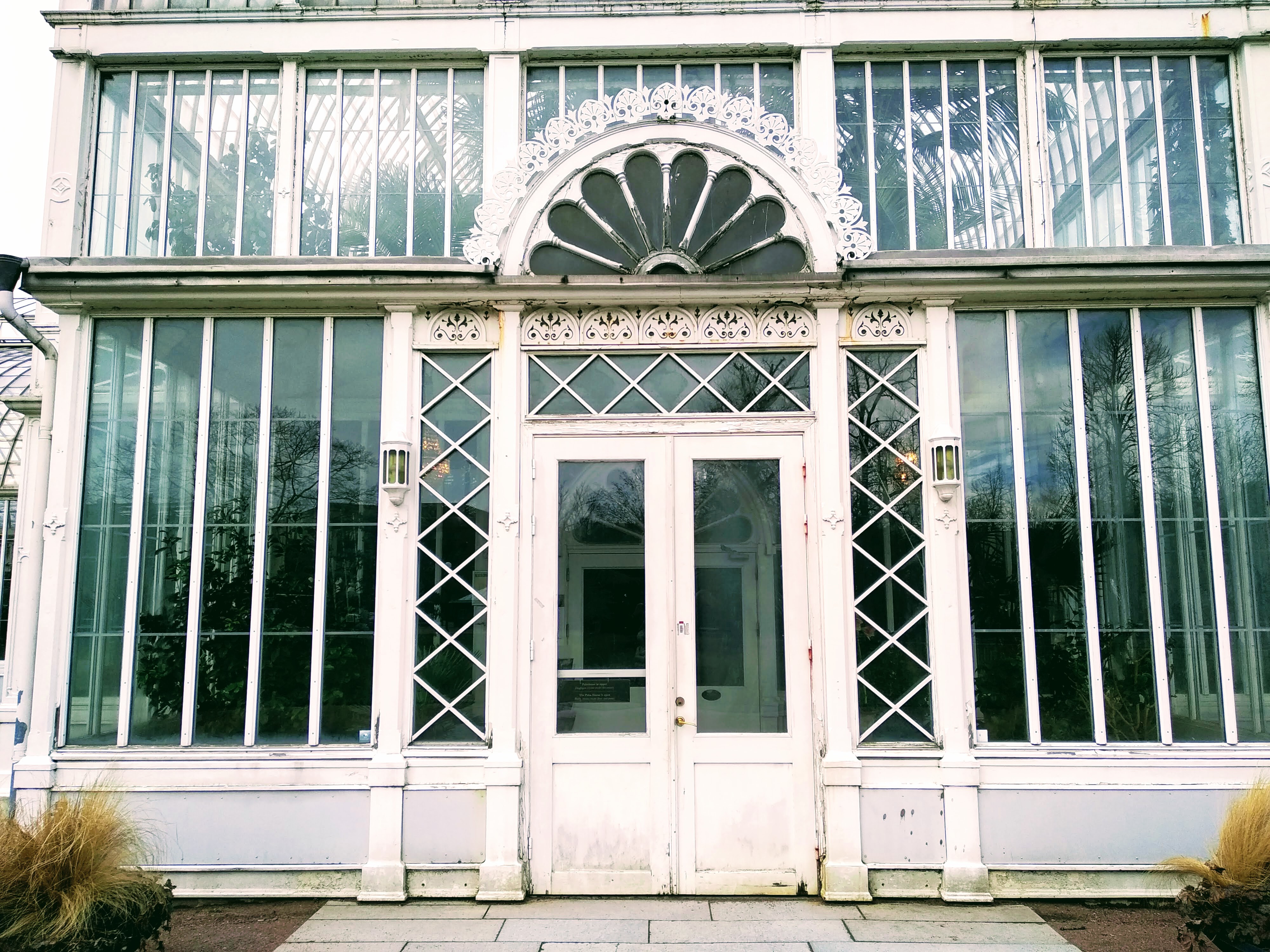 Main entrance to a glass palm house.