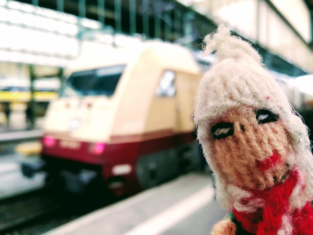 Puppet enjoying a DB train in historic colours.