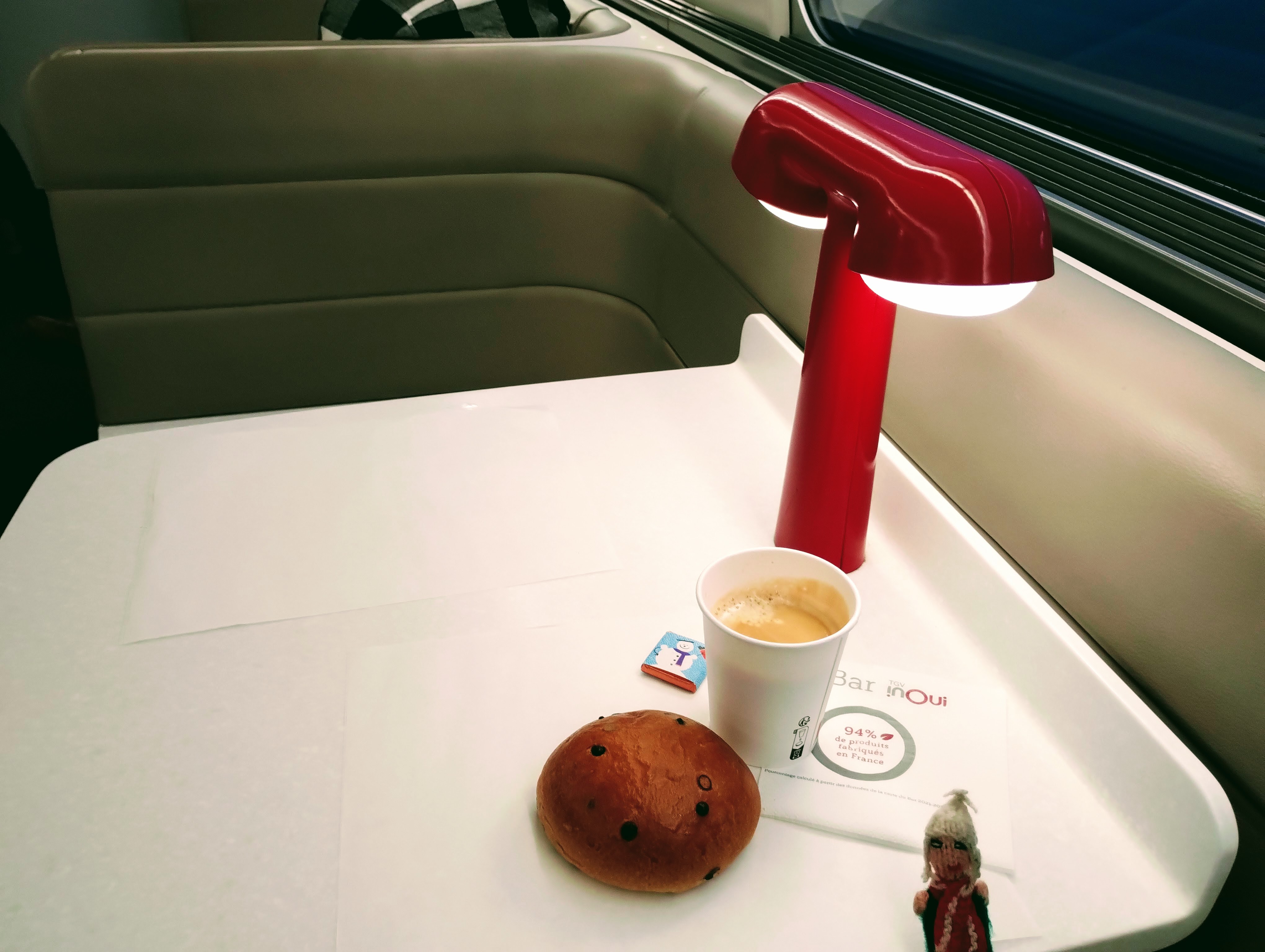 An inadequate brioche and a demoralising coffee in a paper cup on a table in the voiture bar of a TGV bound for Angoulême. Minor puppet gratuity.