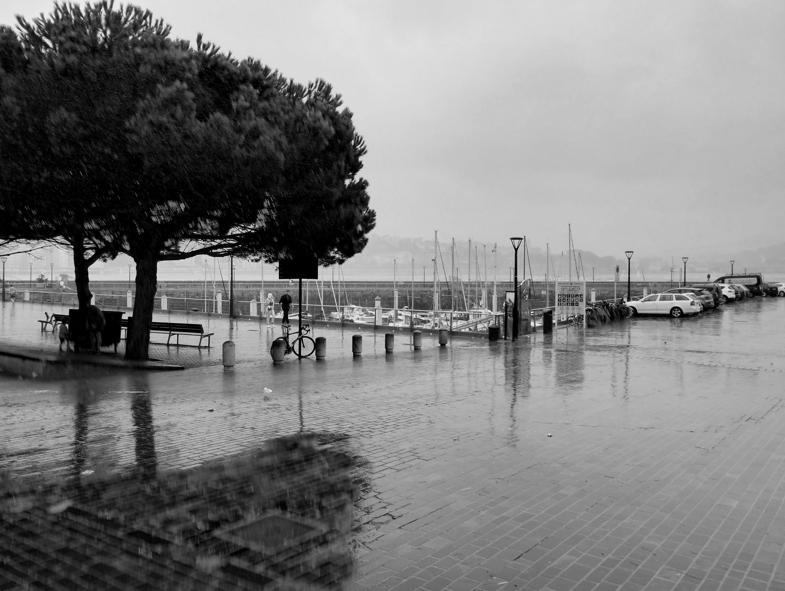Rain sweeps in over the harbour in Donostia.