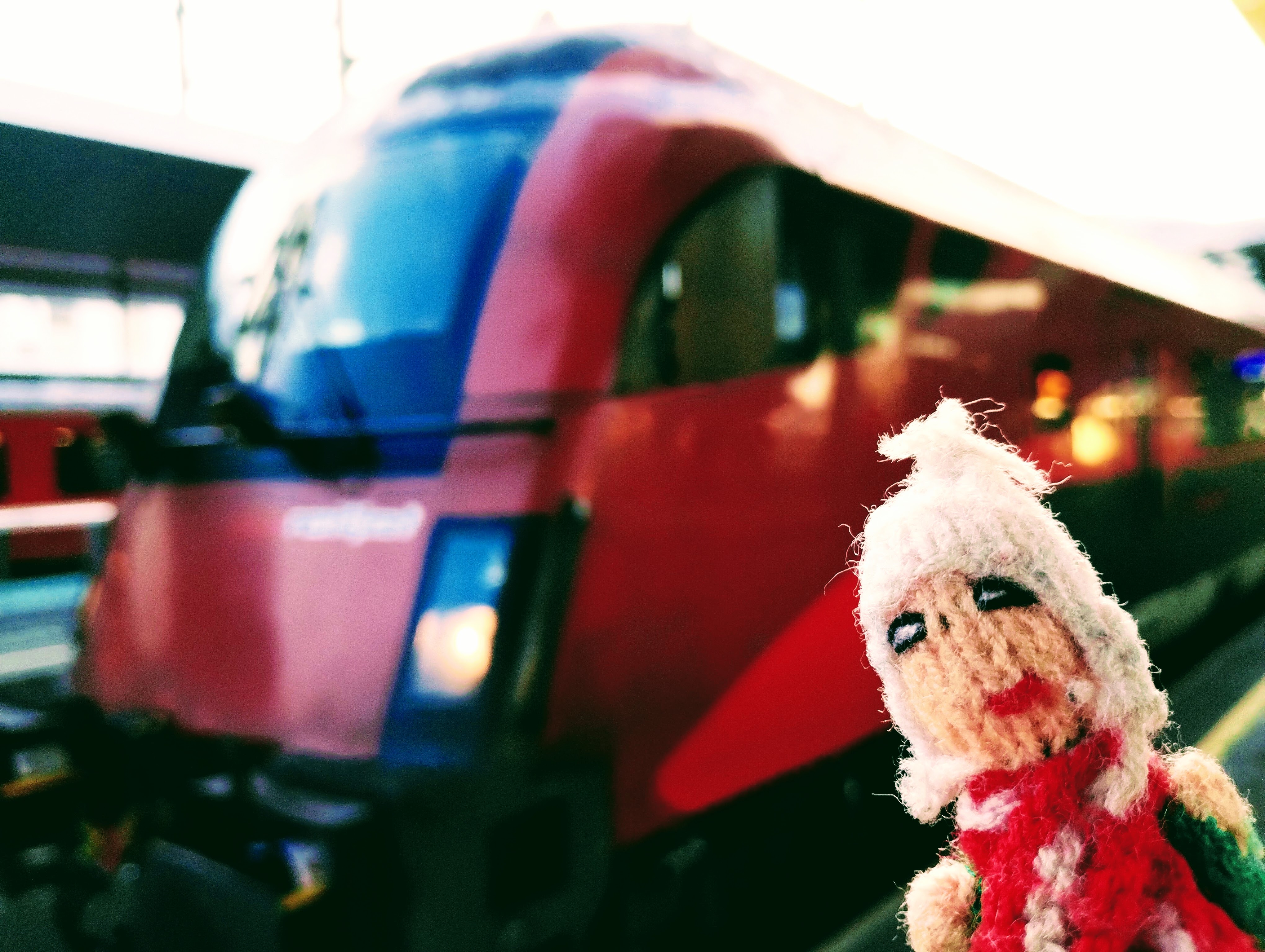 Almost moist with excitement, a finger puppet shudders in anticipation at the pointy end of an ÖBB Railjet.