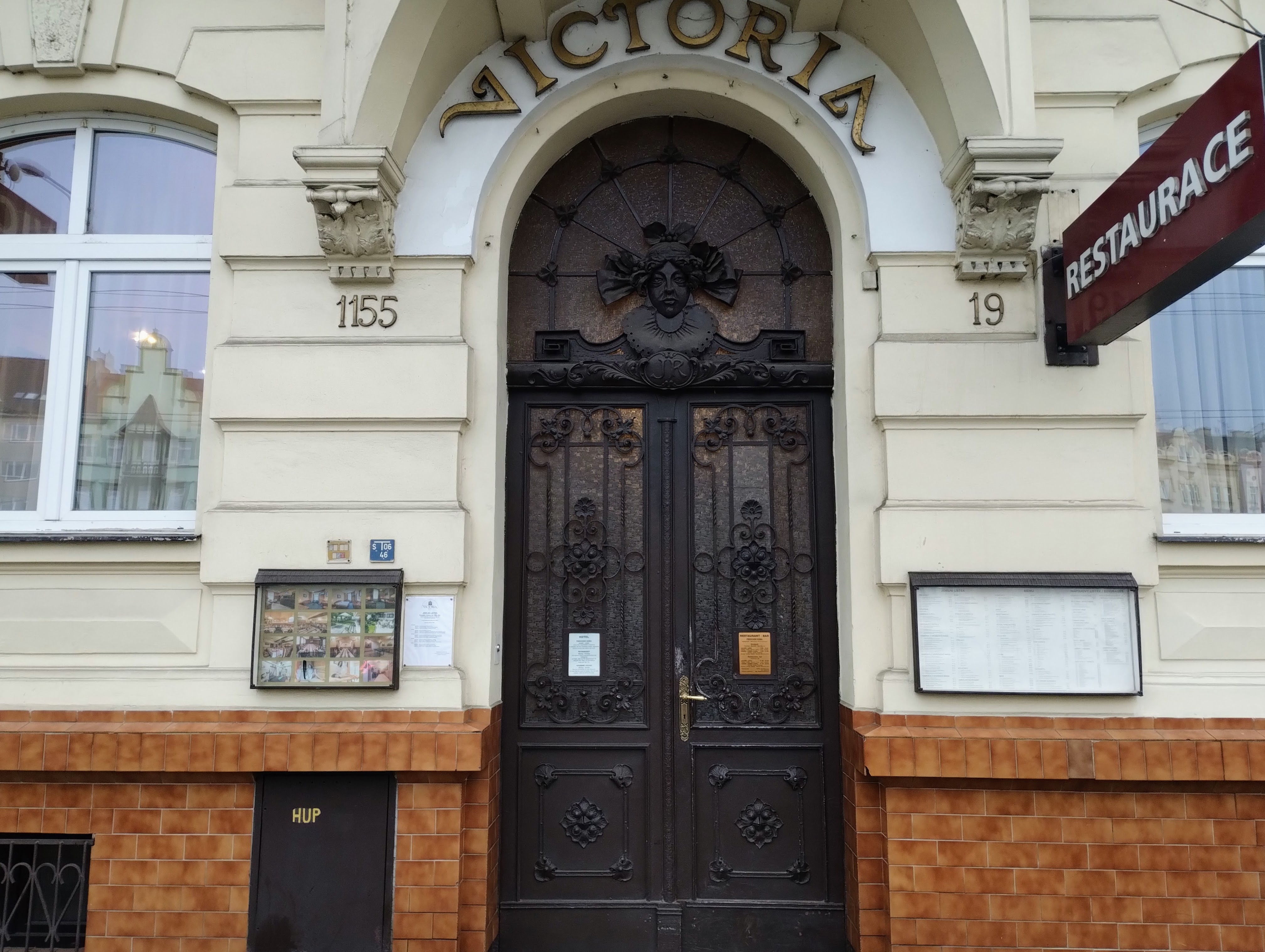 The heavy wooden door to the Hotel Victoria.
