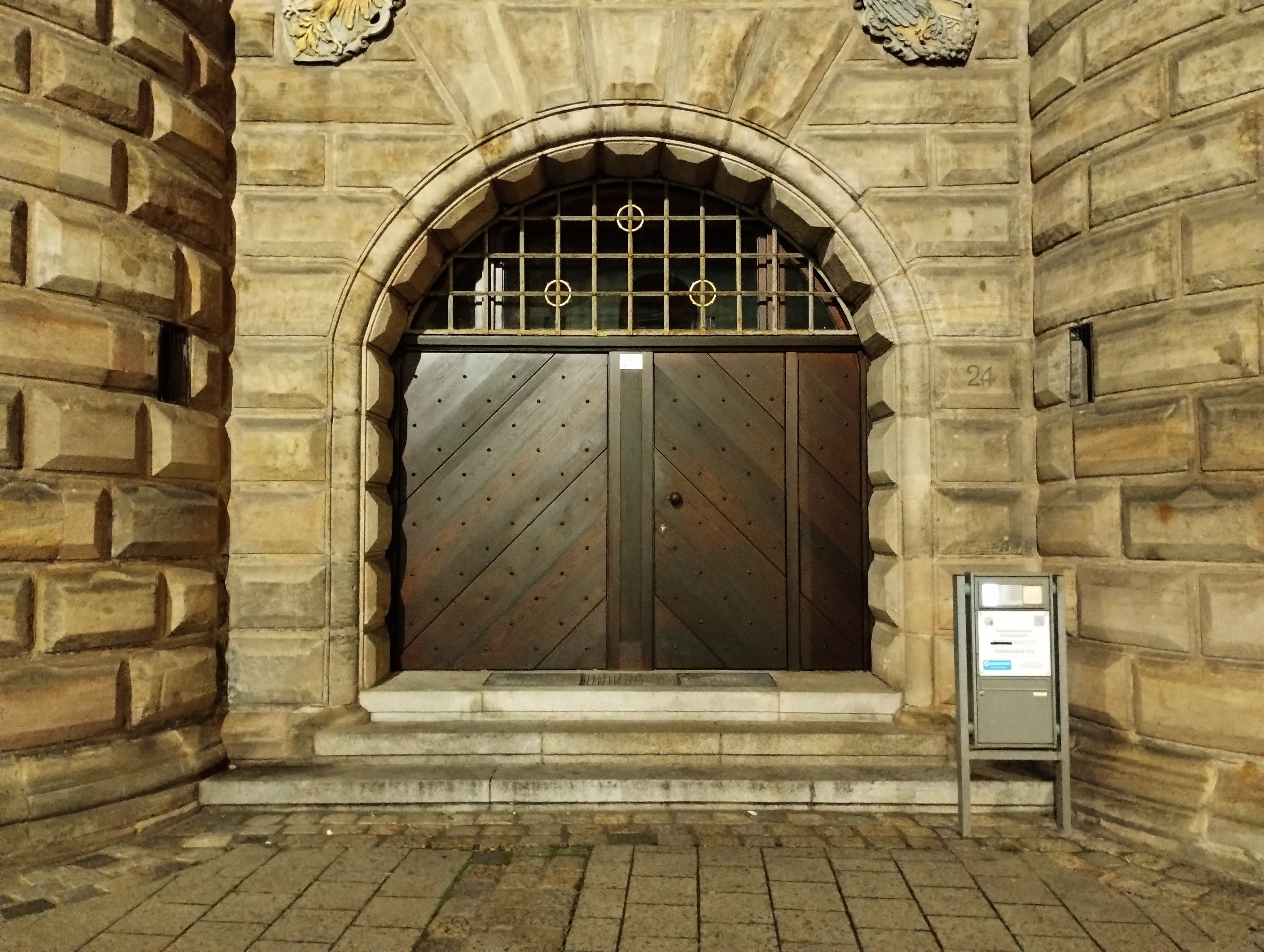 The big wooden doors and stone walls of Nuremberg's police station.